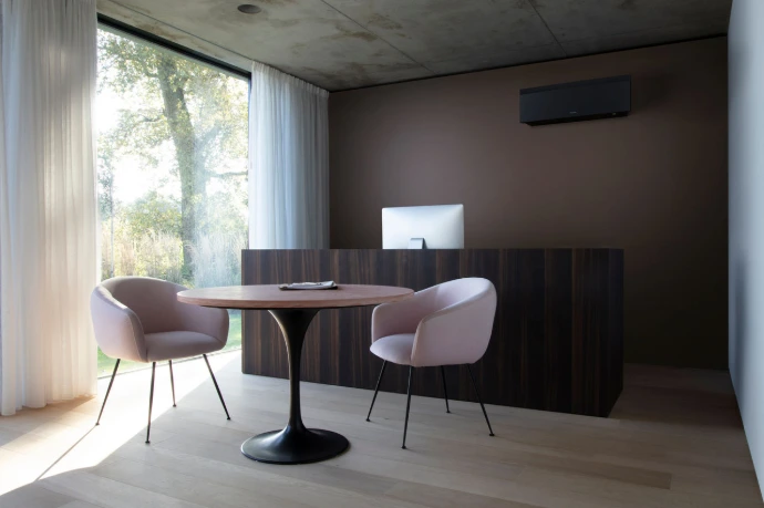 Minimalist Daikin air conditioning unit blending seamlessly into a modern living room.